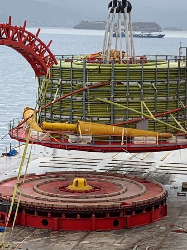 Liftable cable basket being lifted by a crane vessel